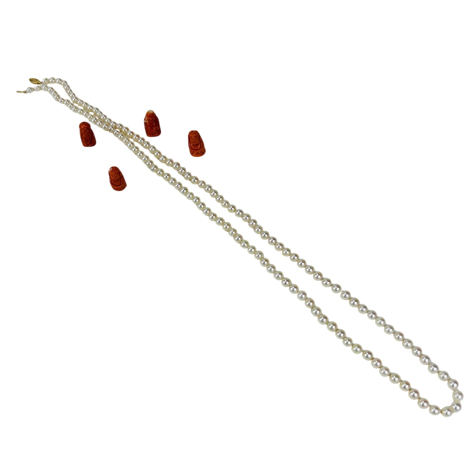 Saltwater Cultured Akoya Pearl Necklace & Coral 5p: Lot includes a single strand Saltwater Cultured Akoya pearl necklace with 14K yellow gold clasp. Accompanied by four carved salmon coral figural beads depicting seated figures. Necklace measures appro