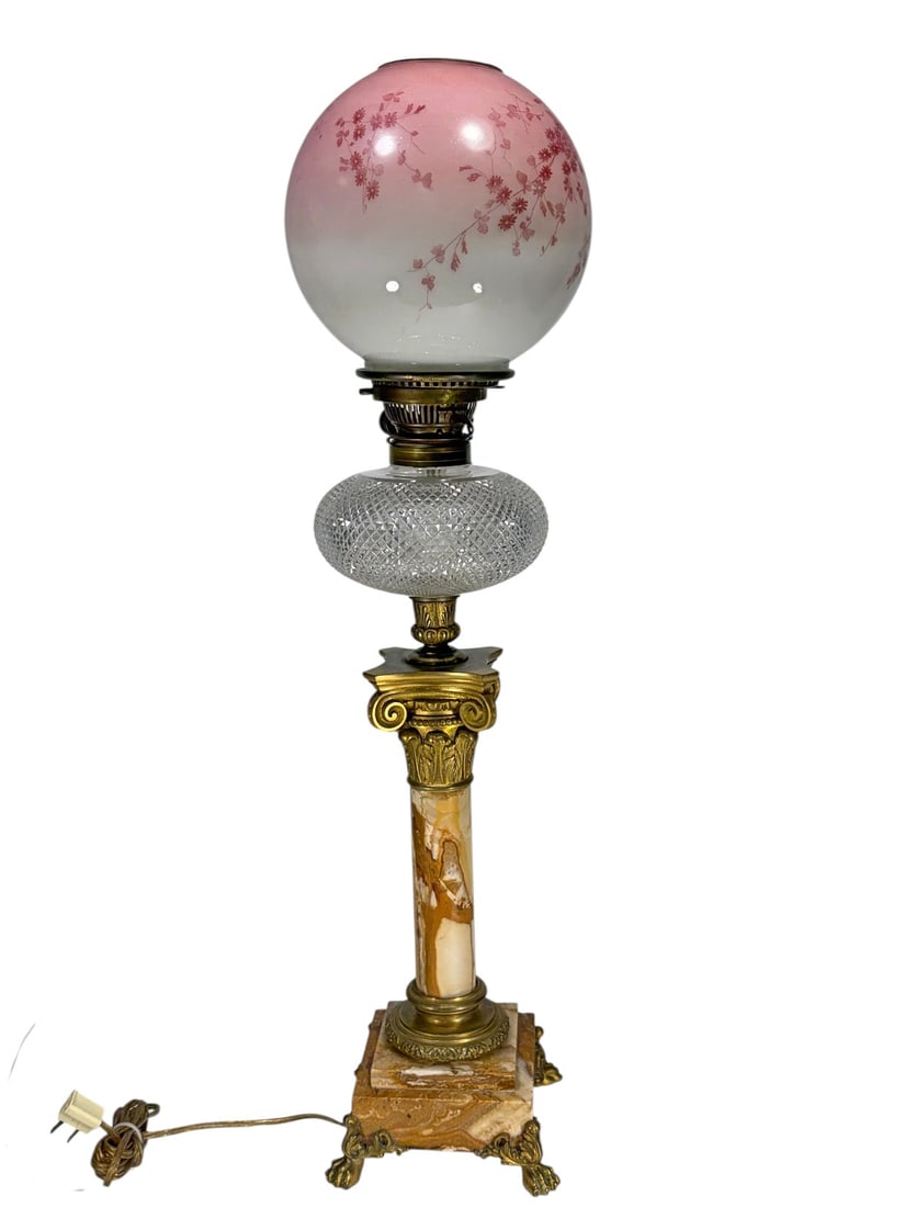 Hinks & Son England Electrified Kerosene Lamp: Antique Hinks & Son, England kerosene table lamp later converted to electricity, featuring a variegated marble column with ornate brass mounts and stepped marble base with decorative feet. Includes a 
