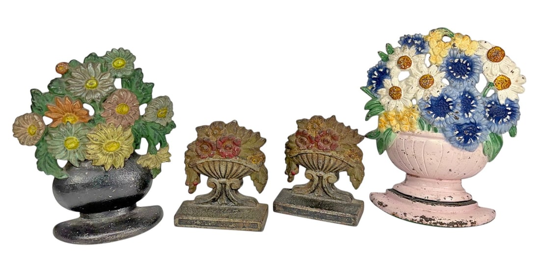Cast Iron Figural Floral Bouquet Doorstops 4pc LOT: Group of four vintage cast iron floral bouquet form doorstops with painted finishes. Includes two handled basket examples and two floral urn or pedestal form examples with molded flower decorations th