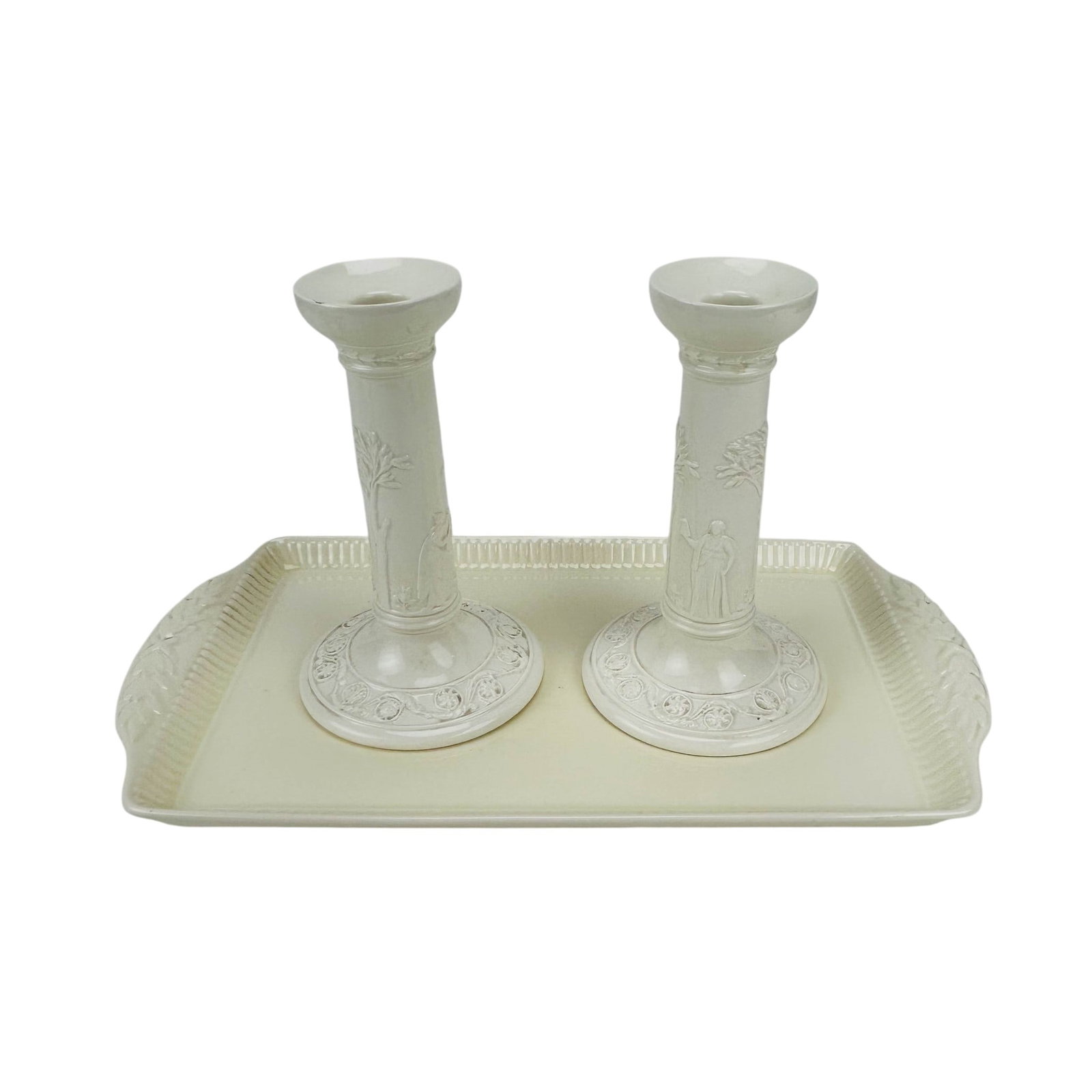 Wedgwood Queens Ware Candlesticks & Tray Set: Wedgwood of Etruria and Barlaston Queens Ware creamware articles comprising a rectangular handled serving tray and a pair of candlesticks. Decorated in relief with classical figural scenes, foliate