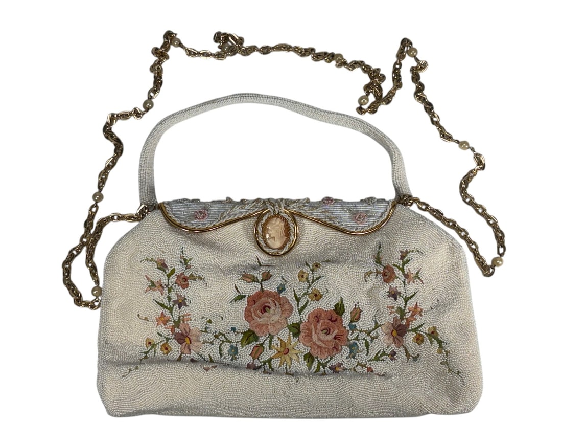Vintage French Beaded Evening Purse w/ Cameo: Vintage French evening purse featuring intricate white micro beadwork with floral decoration, gilt-tone frame, chain strap with faux pearl accents, and carved cameo-style clasp detail. Satin lined int