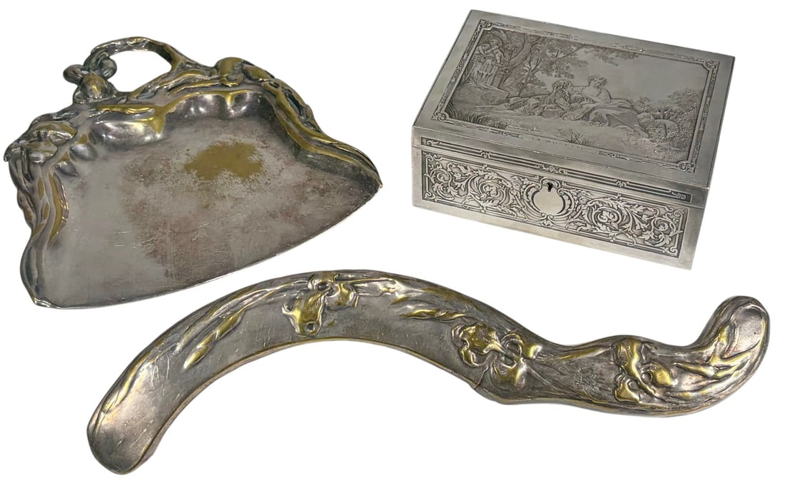 Two Art Nouveau Pieces & Jewelry Box 3pc LOT: Three-piece lot including a silver-tone metal jewelry casket marked Musee du Louvre with engraved La Musette scene and padded fabric-lined interior, together with an Art Nouveau style crumb brush and 