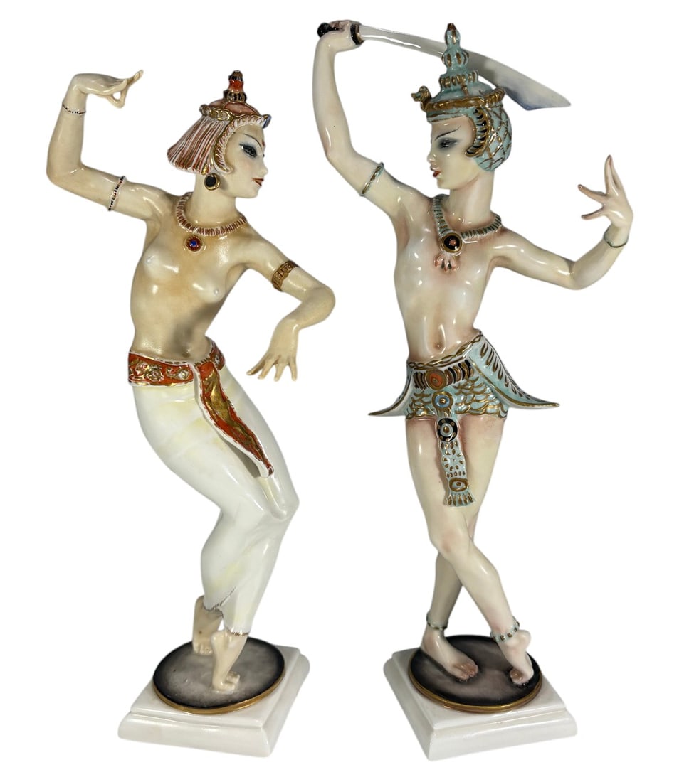 Pair Hutschenreuther C. Werner Porcelain Figures: Pair of Hutschenreuther Selb German porcelain figurines from the Kunstabteilung, modeled by C. Werner, depicting Bajadere and Sword Dancer in polychrome decoration with gilt highlights. Both retain fa