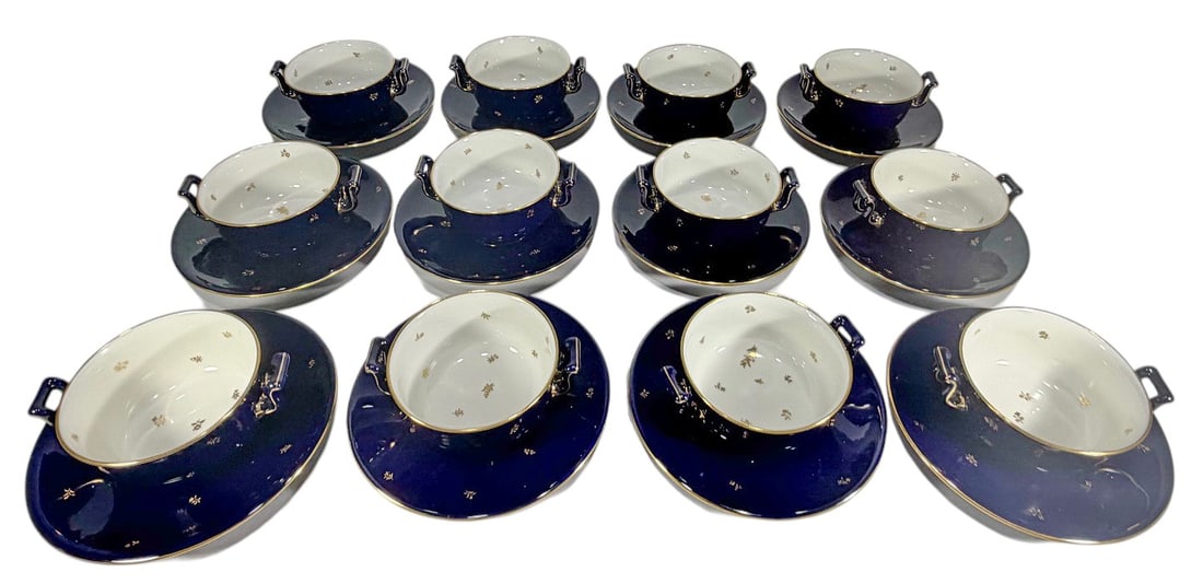 Sevres Style Cobalt Blue & Gilt Consomme 12pc LOT: French Sevres style porcelain 12-piece consomme cup and underplate set in cobalt blue and white with gilt trim and delicate gilt floral decoration, from the same service set. Marked Manufacture Nation
