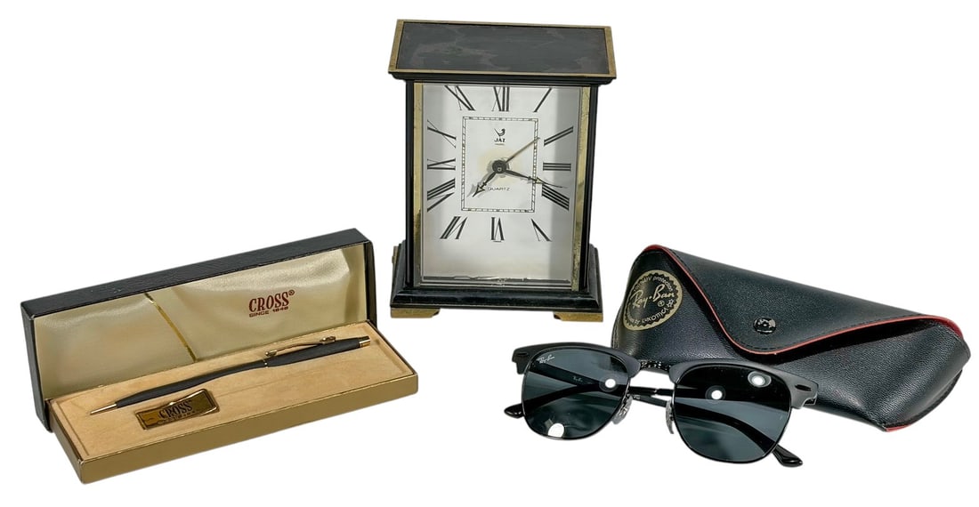 Designer Desk Accessories & Collectibles Items 4pc: Four-piece lot including Ray-Ban sunglasses with case, Cross ballpoint pen in fitted presentation box, and a Jaz Paris quartz desk clock assembled in France. The clock measures 5 inches high by 4.25