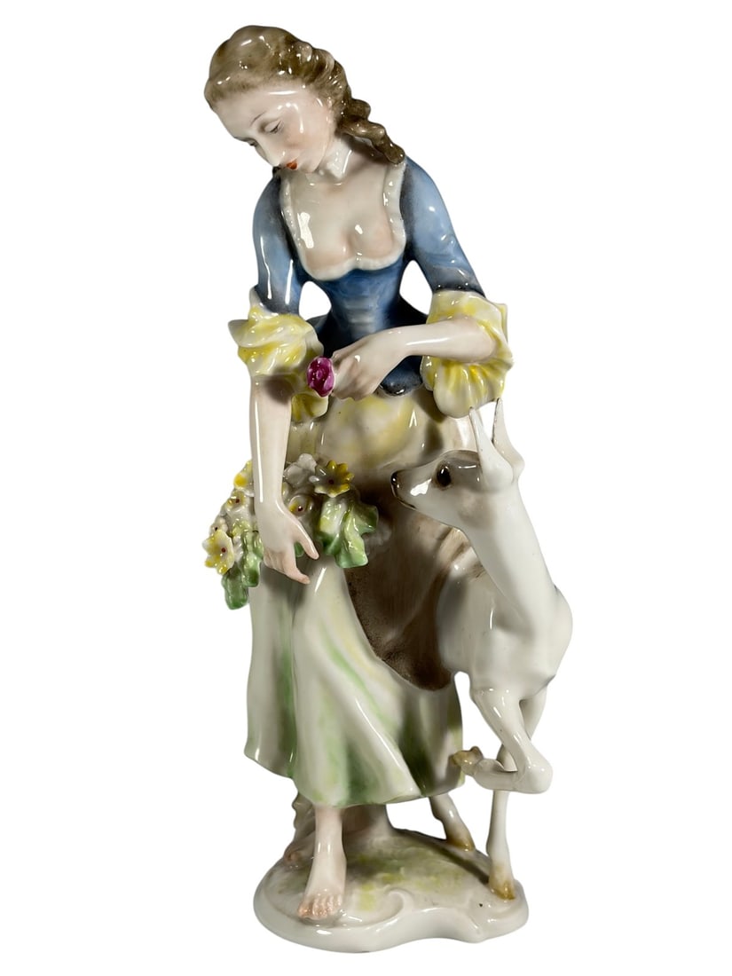 Hutschenreuther Porcelain Lady w/ Deer Figurine: Hutschenreuther Selb German porcelain figural group depicting a young lady in period dress holding a flower, accompanied by a deer at her side. Finely modeled with hand-painted pastel decoration, flor