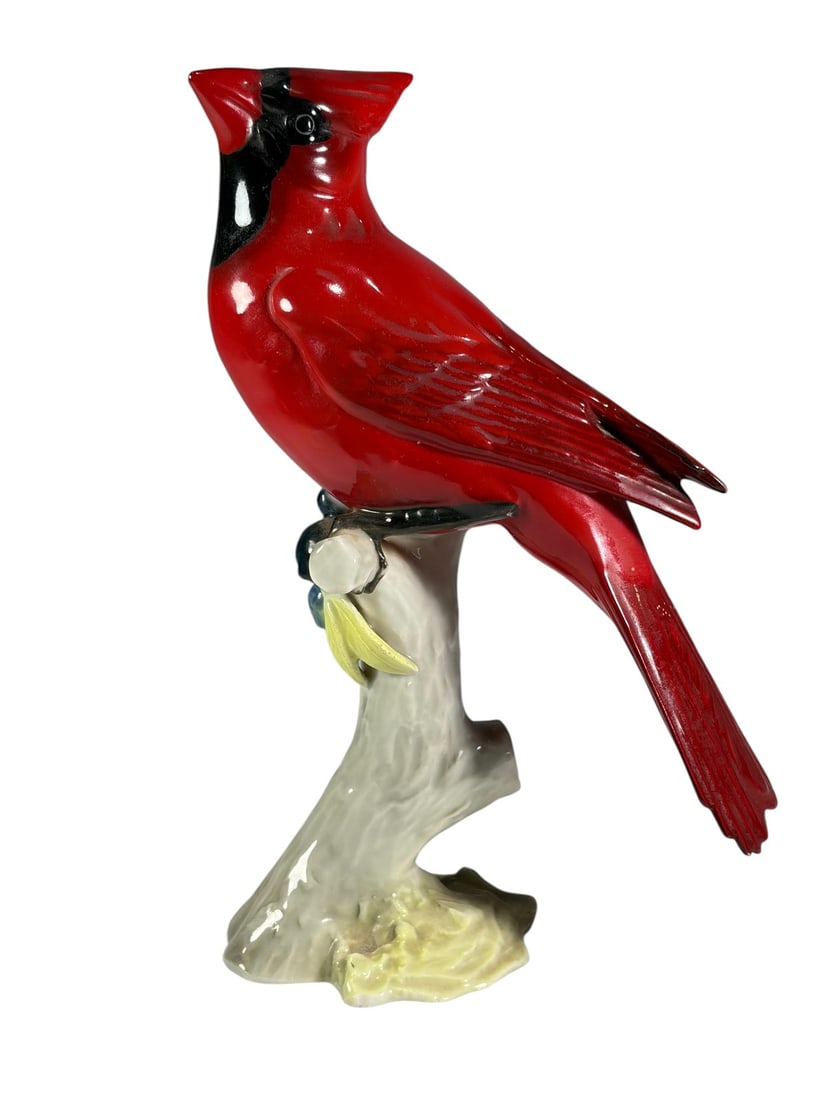 Gunther Granget Hutschenreuther Cardinal Figure: Gunther Granget for Lorenz Hutschenreuther Kunstabteilung porcelain cardinal figure, modeled as a vibrant red cardinal perched on a naturalistic tree branch with berry decoration. Finely hand-painted 