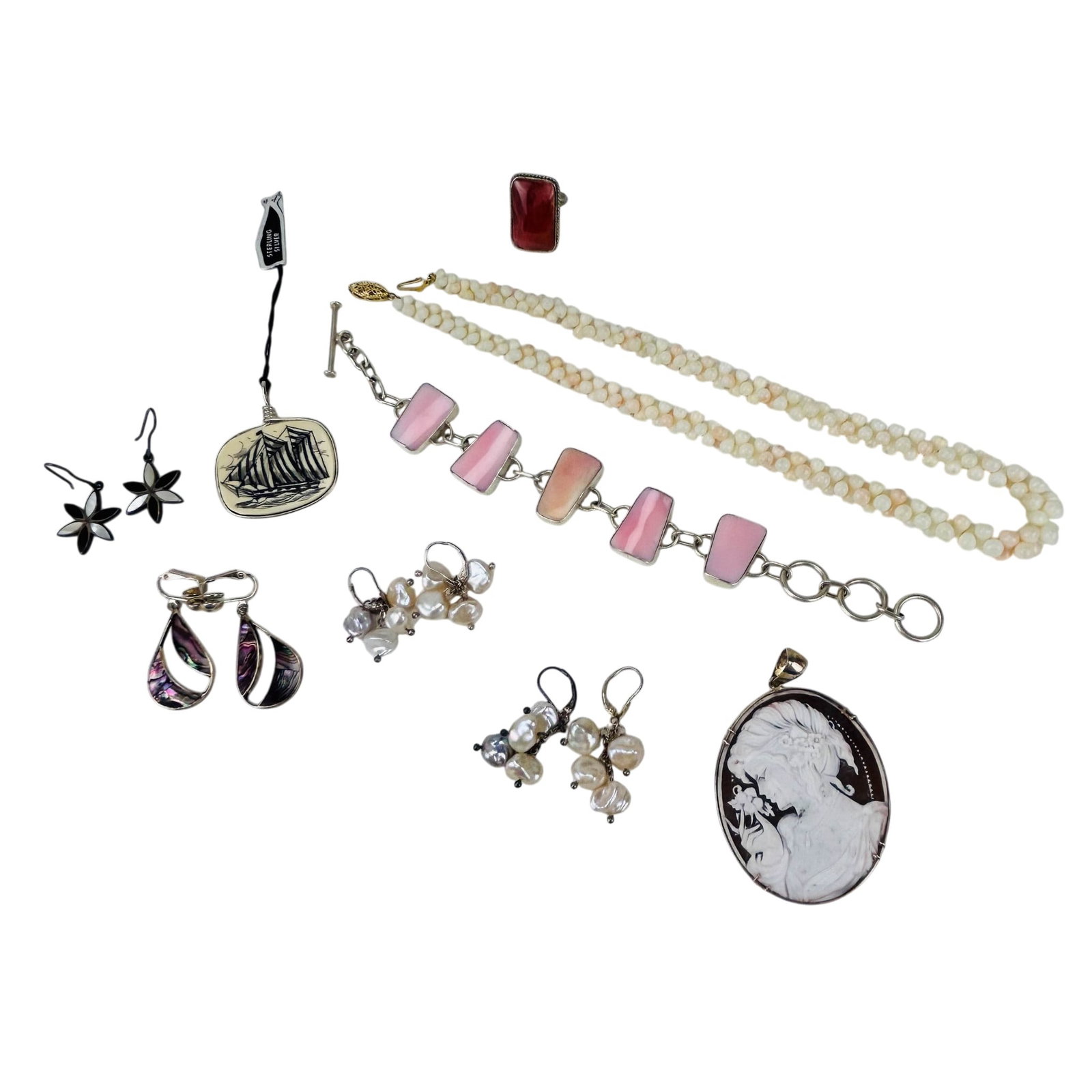 Cameo Pendant Angelskin Necklace Ring Earrings 9pc: Grouping of costume jewelry featuring a carved shell cameo pendant brooch depicting a classical female profile, pink panel shell bracelet, angelskin bead strand with cream toned beads and 14K clasp, r