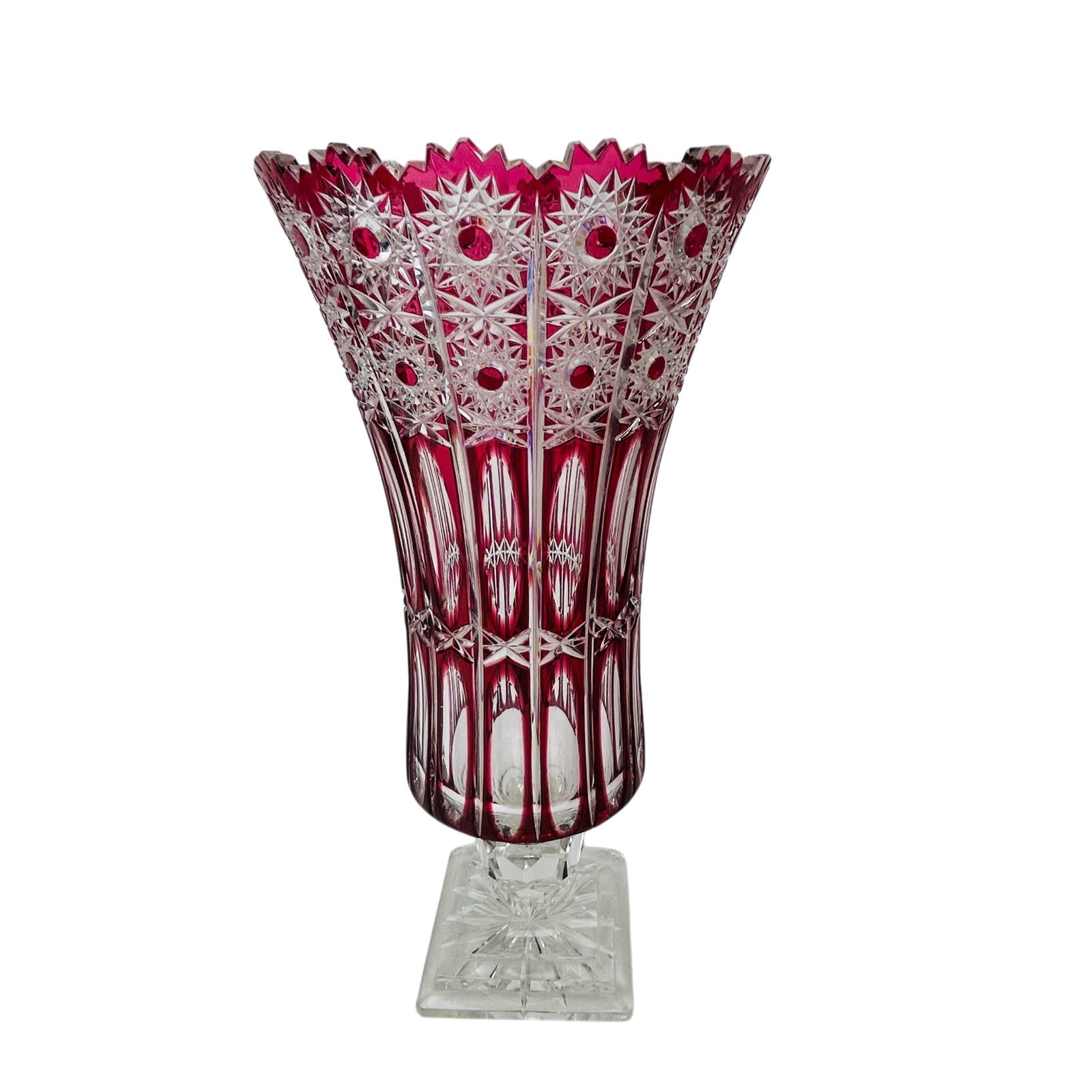 Czech Cut Crystal Red to Clear 17" Pedestal Vase: Bohemian Czech deep cut crystal crystal pedestal vase in ruby red overlay glass with trumpet form body and flared serrated rim. Decorated throughout with deeply cut starburst, hobstar, and panel motif