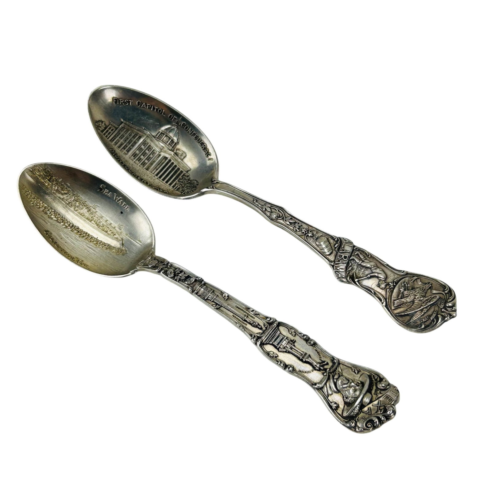 Watson Sterling Alabama & Texas Souvenir Spoons 2p: .Pair of Watson sterling silver 925 souvenir spoons. Comprising an Alabama example depicting bird and figural motifs to the handle with First Capitol of Confederacy Montgomery Ala decoration to the bo