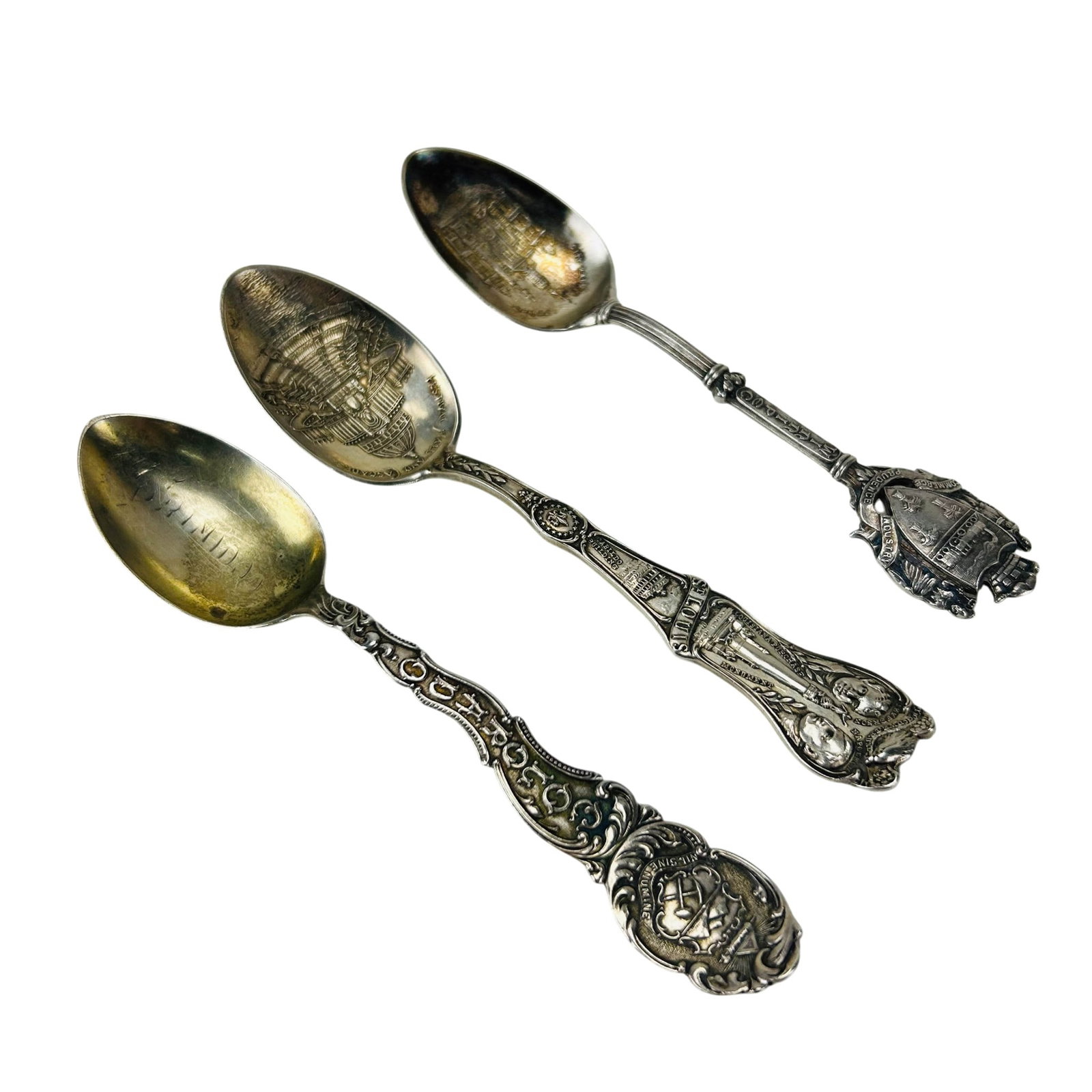 Whiting Roden Bros Watson Sterling Souvenir Spoons: Group of three sterling silver 925 souvenir spoons. Comprising a Whiting Colorado example with engraved bowl and elaborate handle, a Roden Bros. Winnipeg example depicting city hall with crest form fi