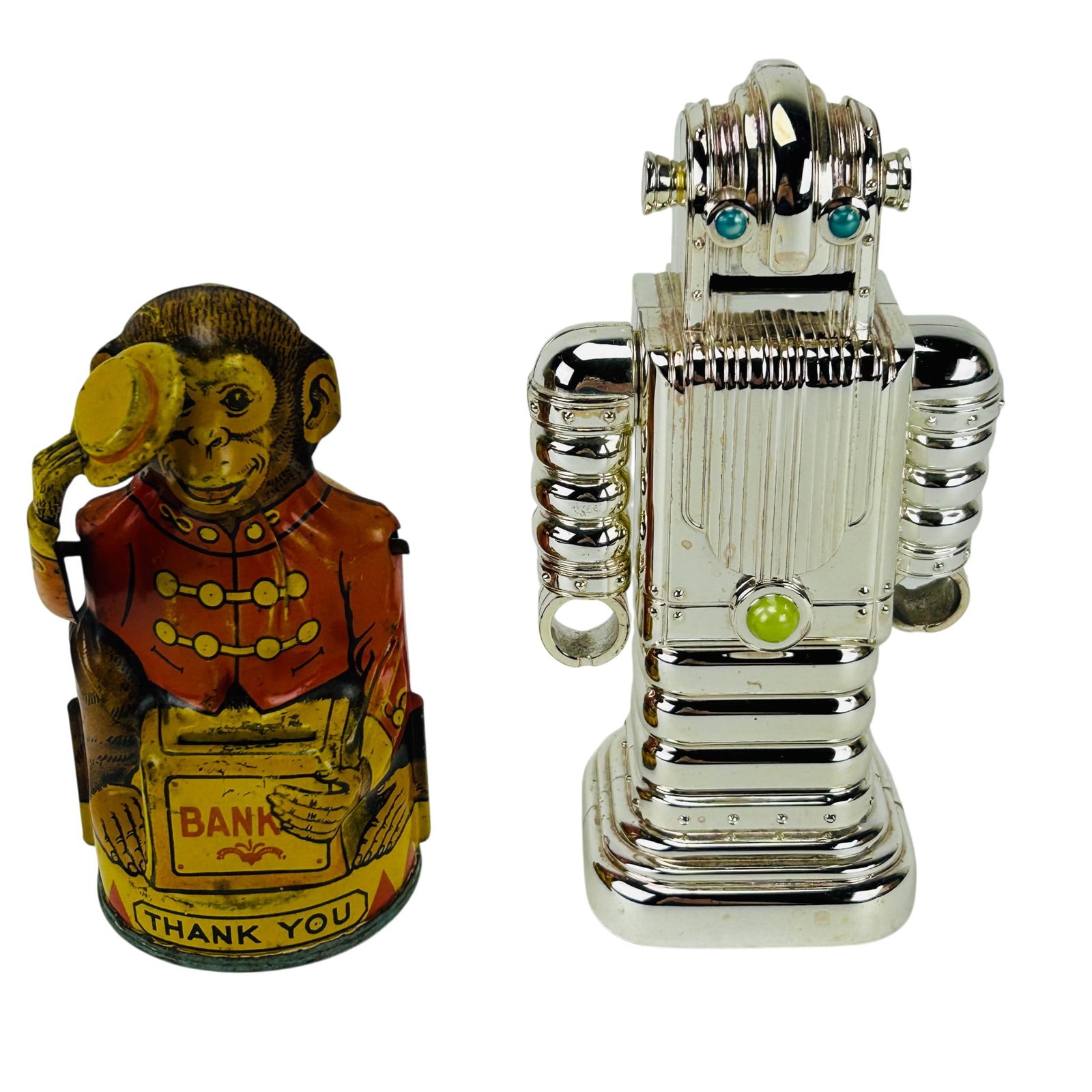 Robot and Chein Monkey Tin Novelty Coin Banks 2pc: Grouping of two novelty banks including a futuristic chrome tone robot form coin bank with blue and green accent details together with a lithographed Chein monkey mechanical style savings bank. Robot