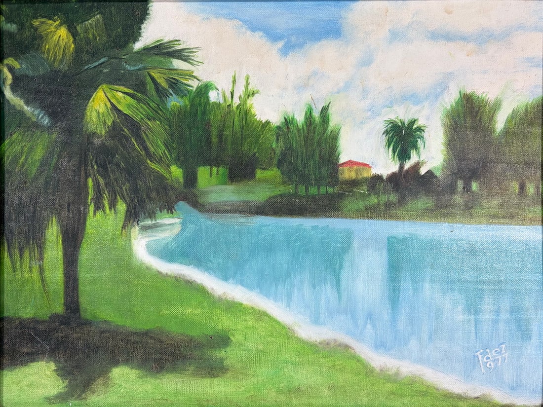 1977 Landscape Oil Painting on Cardboard SIGNED: 1977 Signed landscape oil painting on cardboard. Scenic river landscape with palm trees and distant cottage under cloudy sky. Work Size: 12 x 16 in. Dimensions: 18.5 X 22.5 X 1.5 in. Condition: Good