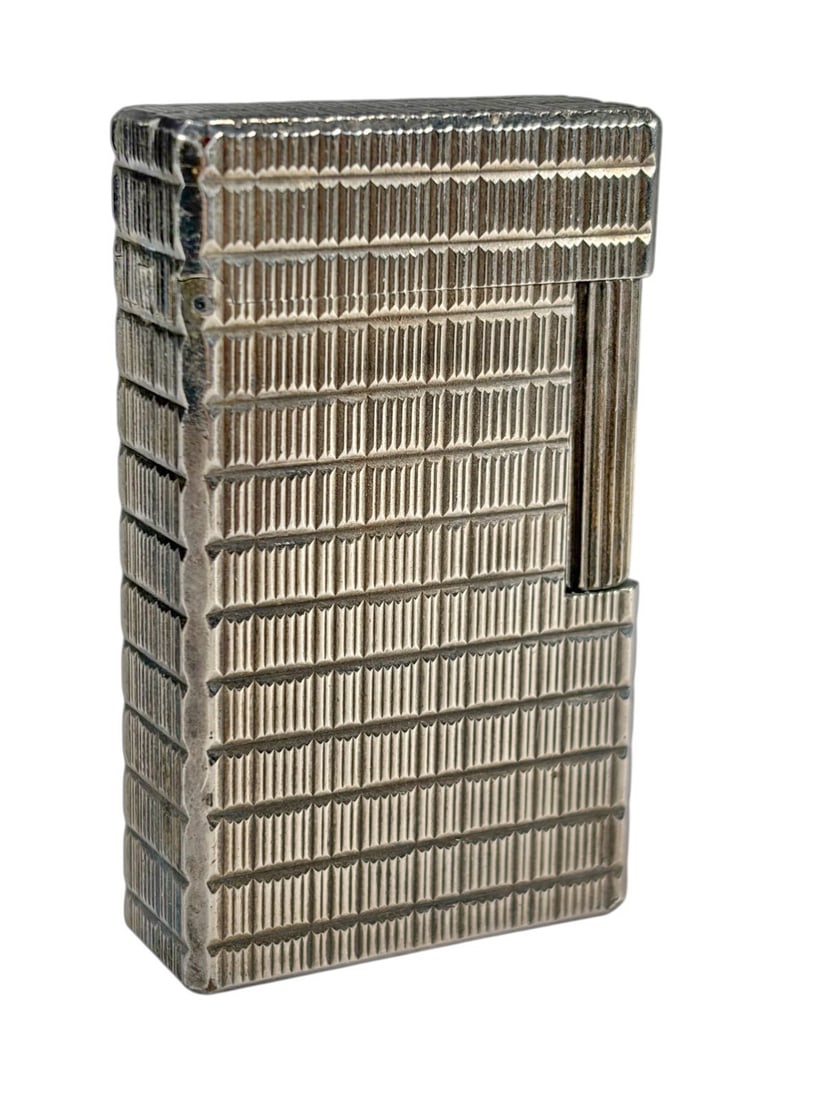 VTG St Dupont, Paris Ligne 1 Silver Plated Lighter: S.T. Dupont Paris Ligne 1 silver plated lighter with vertical line pattern, fluted roller, and hinged lid engraved D. Base is stamped 'S.T. Dupont Paris Made in France.' Includes original box and book