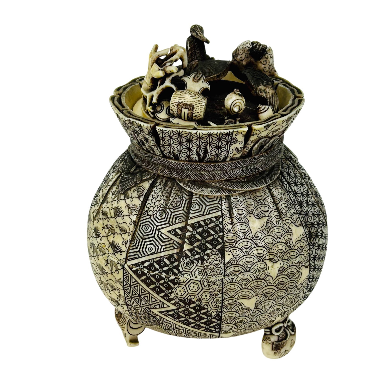 Japanese Lidded Carved Incense Censer Altar Box: Japanese kogo censer vessel hand carved from naturally occurring material. Showcases an overall patchwork design with finely detailed geometric and floral motifs in brown and cream tones. Modeled in r