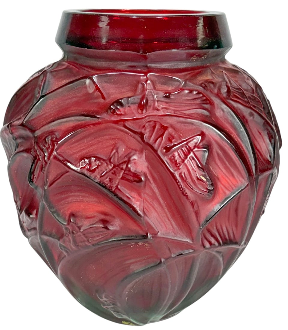 After R. Lalique Sauterelles Red Art Glass Vase: Frosted and ruby red art glass vase decorated with molded grasshopper motif in relief. After R. Lalique France signed to base. Heavy molded glass form with deep cranberry coloration and frosted