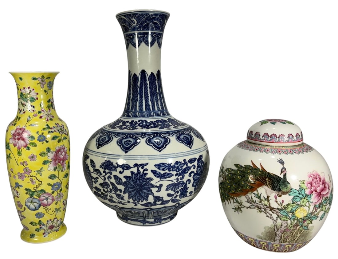 Chinese Porcelain Vases & Ginger Jar 3pc LOT: Group of three Chinese porcelain decorative pieces including a large blue and white bottle form vase, a yellow floral porcelain vase with red character mark to underside, and a covered porcelain ginge