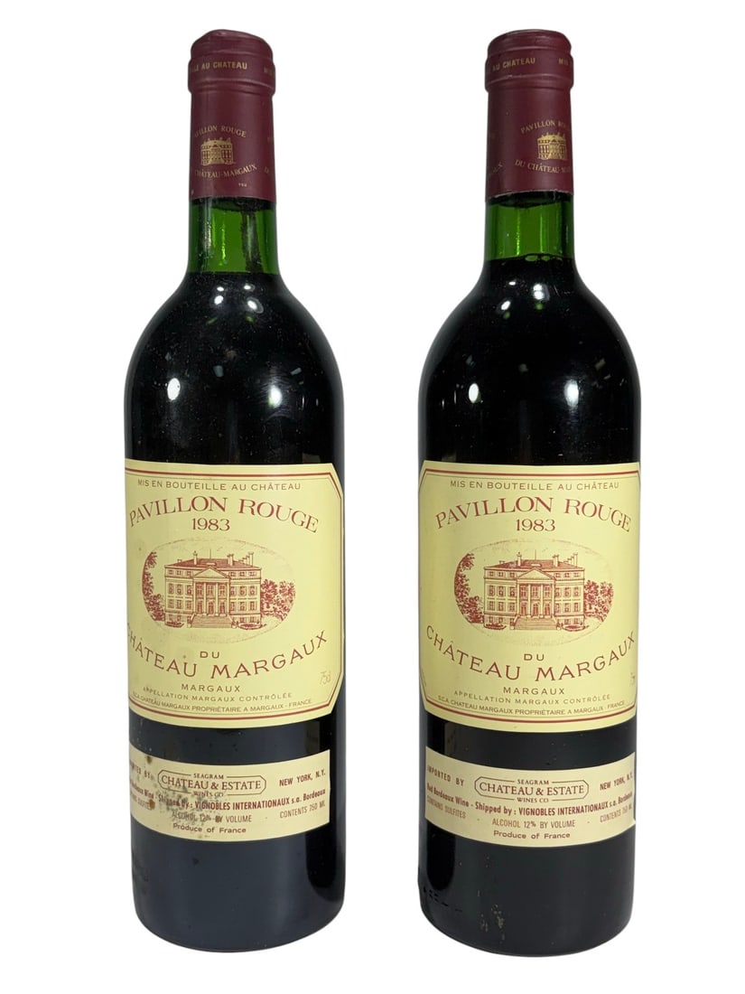 1983 Pavillon Rouge du Chateau Margaux Bottles 2pc: Pair of vintage 1983 Pavillon Rouge du Chateau Margaux Bordeaux red wine bottles from France. Second label wine of Chateau Margaux, each retaining original labels and foil capsules. Imported by Chatea