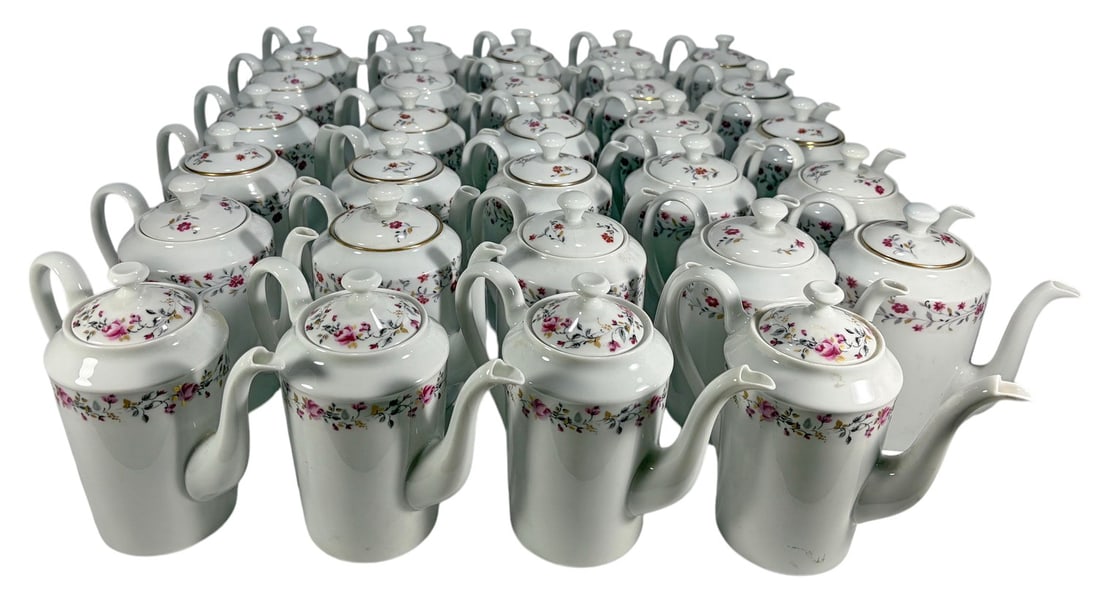 Limoges France Porcelain Coffeepots 29pc LOT: Group of twenty-nine Limoges France porcelain coffeepots in two coordinating floral patterns. White porcelain bodies with pink, red, and multicolor floral decoration, some with gilt trim accents. Incl