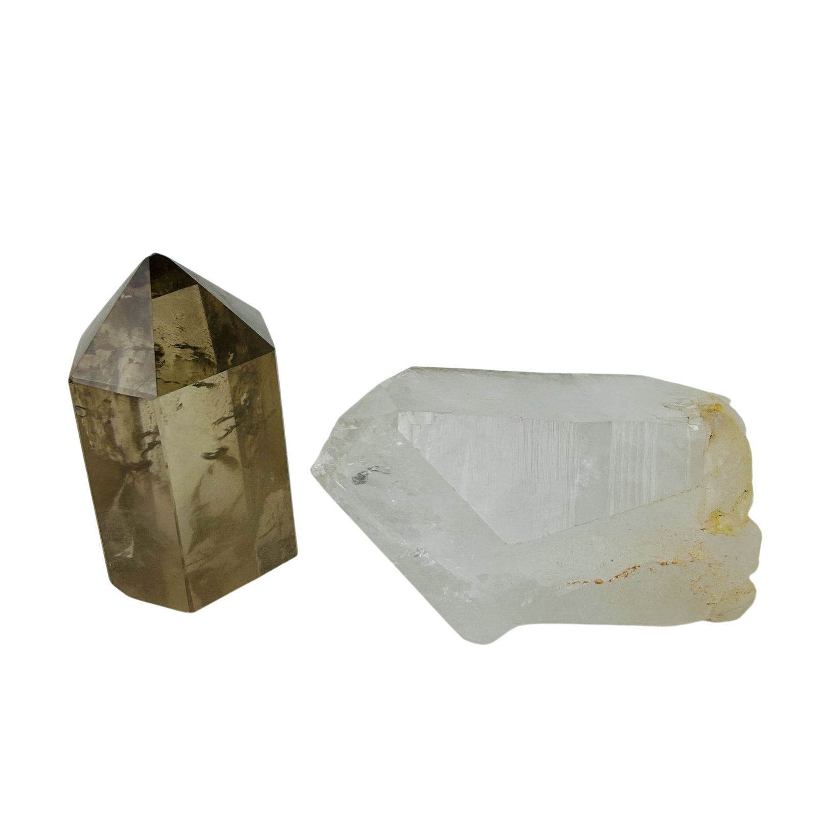 Smoky & Clear Quartz Mineral Stone Specimen LOT: Group of two carved quartz crystal obelisks including one clear quartz point with natural inclusions and one smoky quartz polished spire. Each fashioned in faceted tower form and presented as decorati