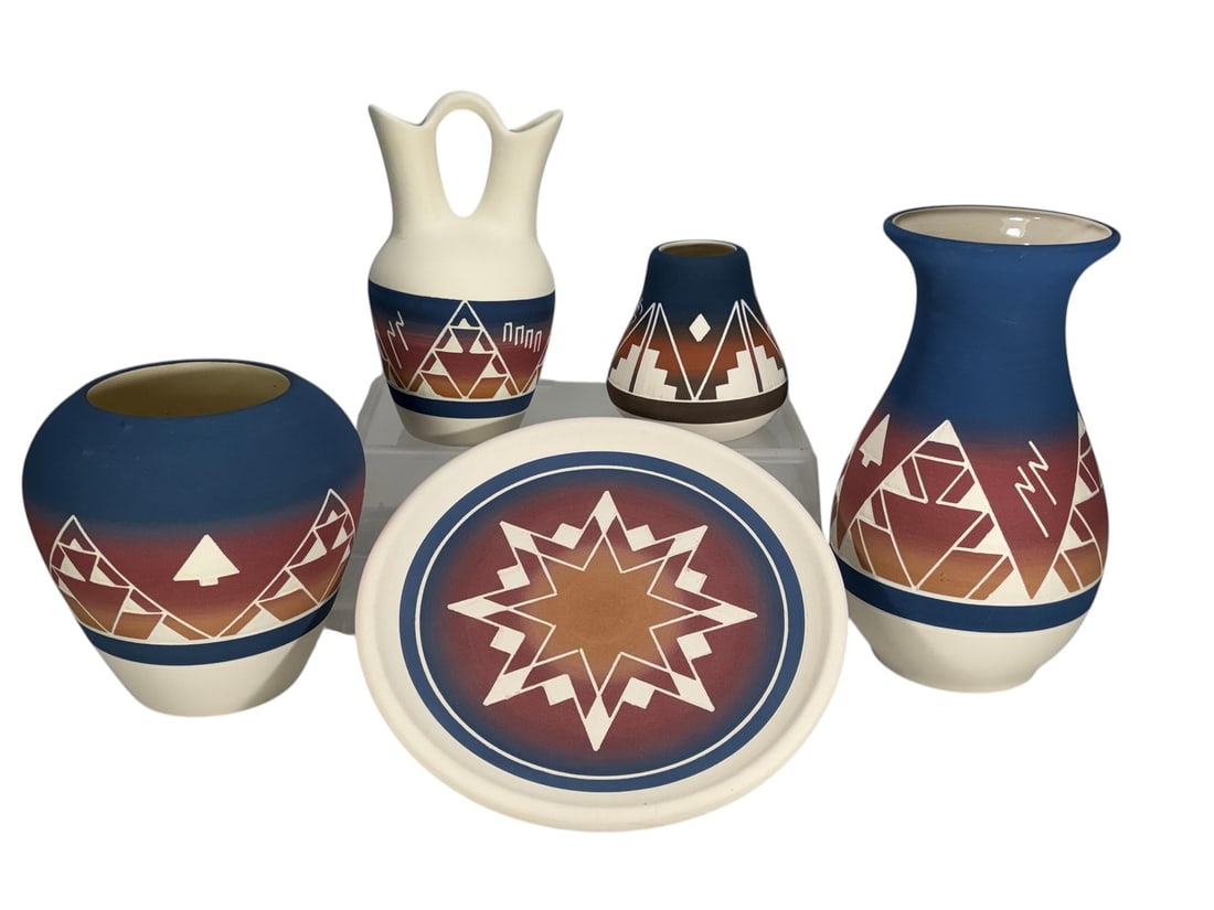 Native American Sioux Blue & Brown Pottery 5pc LOT: Collection of 5 handcrafted Sioux pottery pieces including bottle-form vases, a round vase, miniature vase, handled wedding vase, and matching decorative plate. Features matte blue exterior with glaze