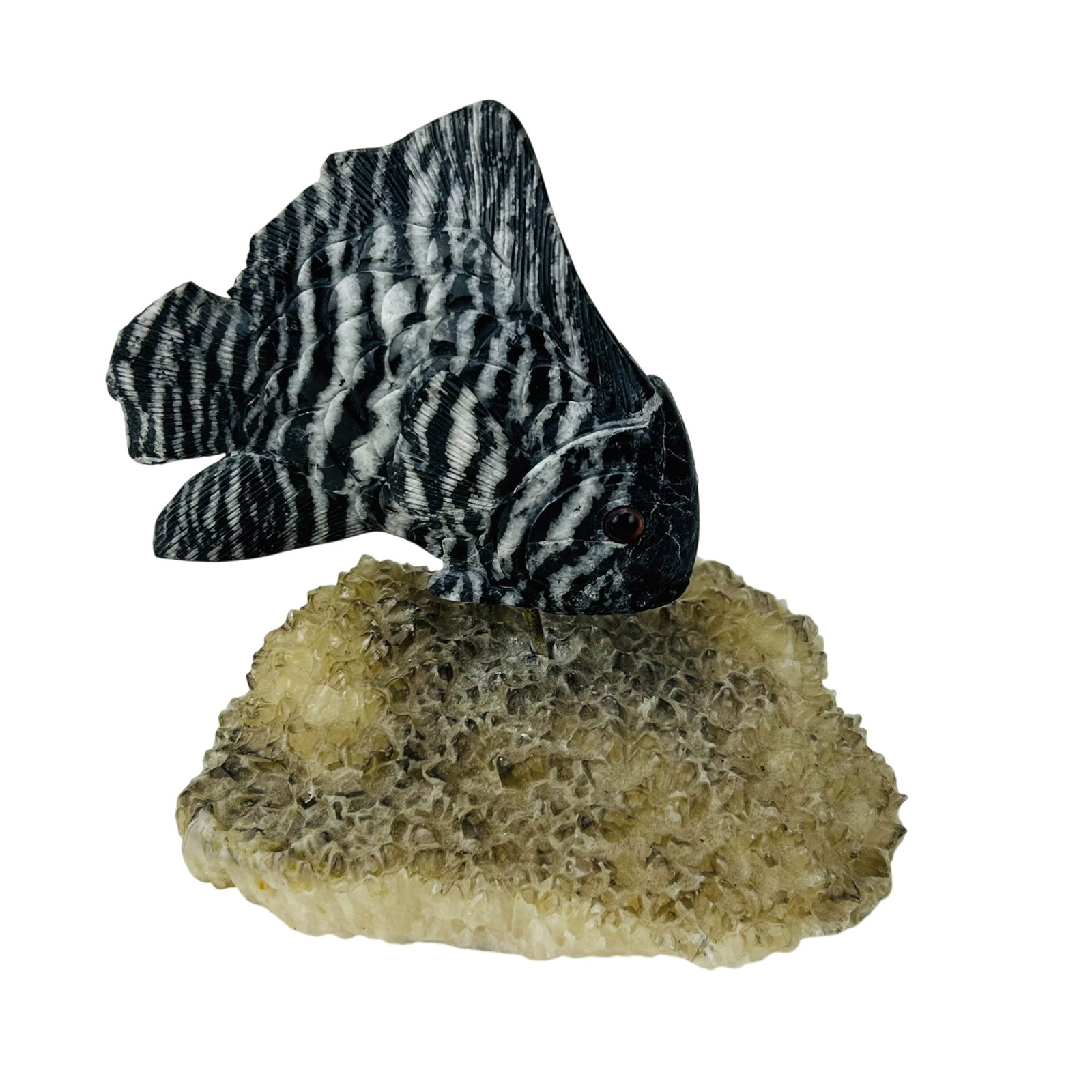 Carved Stone Tropical Fish on Quartz Crystal Base: Decorative hand carved Zebra Marble or Onyx fish stone sculpture with incised scale and fin details, rendered in black and white bands. Mounted on a metal support rising from a natural quartz crystal