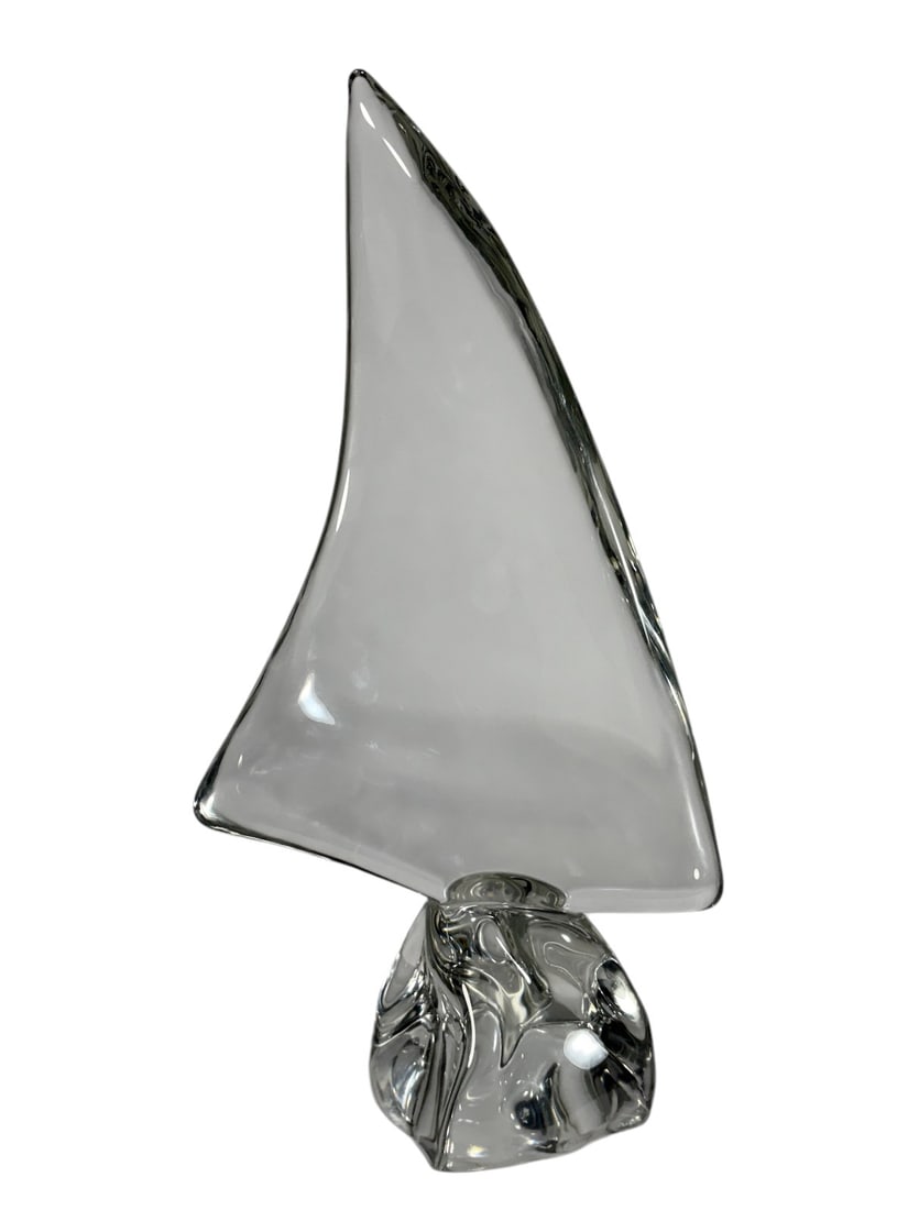 Daum France Crystal Sailboat Sculpture Signed: Large Daum France crystal sailboat sculpture formed in clear crystal with sweeping sail and sculptural wave-form base. The elegant modernist design captures the movement of a sail under wind and is ex