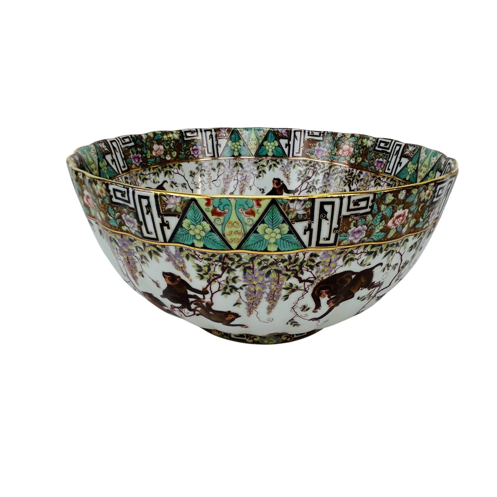 Chinese Porcelain Monkey and Wisteria Centerbowl: Chinese 20th century porcelain footed bowl decorated with numerous monkeys among flowering wisteria vines, against a white ground. Interior and exterior feature hand painted simian scenes with floral