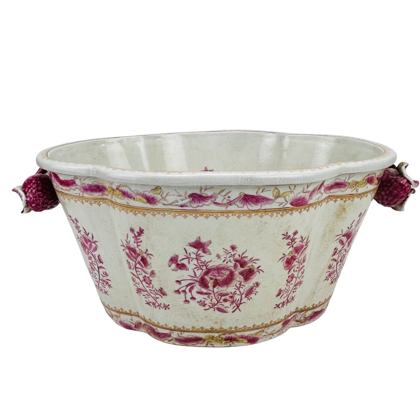 United Wilson Factory Floral Porcelain Planter 20": Late 20th century United Wilson Factory porcelain planter in an oval form with molded fruit and leaf form handles. Decorated in a chinoiserie inspired pink floral transfer pattern with repeating flora