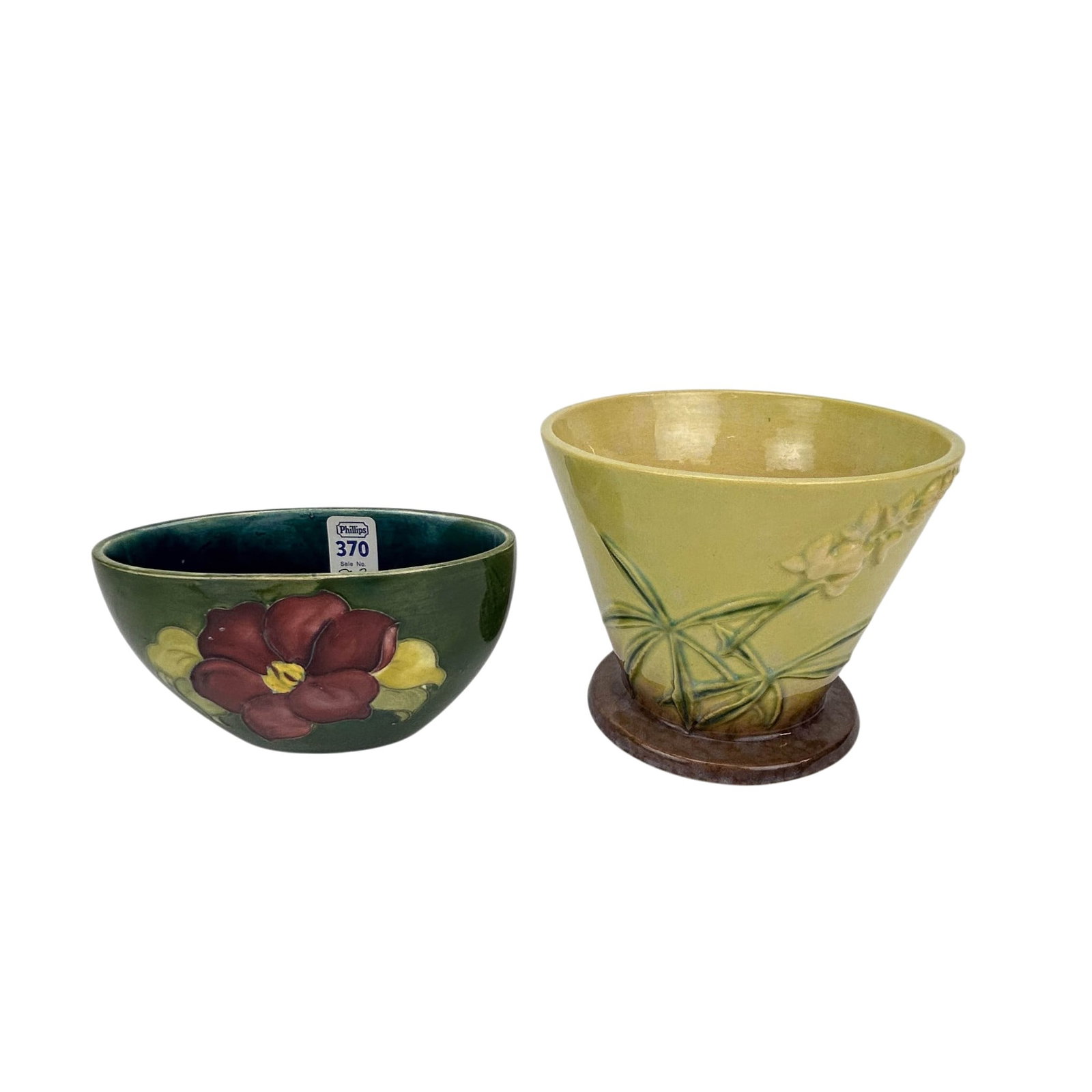 Roseville & Moorcroft Art Pottery Floral Vases 2p: Includes a Moorcroft English art pottery bowl decorated with a tube lined red, yellow and pink Clematis floral motifs against a green ground. Retains the printed Potters to the Late Queen Mary paper l