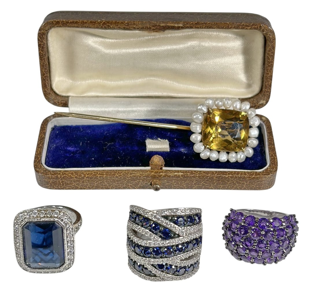 Sterling Silver 925 Rings & Glass & Metal Pin 4pcs: Group of four jewelry items including three sterling silver 925 rings and one yellow metal stick pin. Rings feature blue and purple faceted gemstones with clear accent stones, marked 925 and sized app