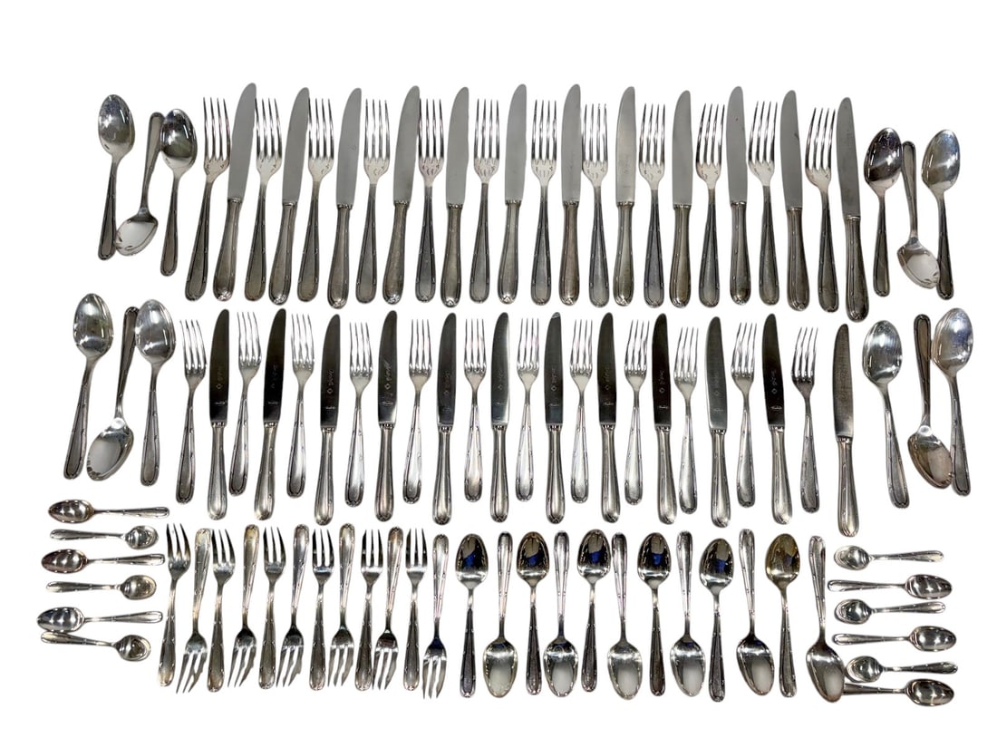 Christofle Silverplate Flatware Service 96pc LOT: Fine 96 pieces Christofle silverplate flatware service manufactured in Argentina under French supervision, circa mid-20th century. The set comprises 12 dinner knives, 12 dinner forks, 12 soup spoons, 