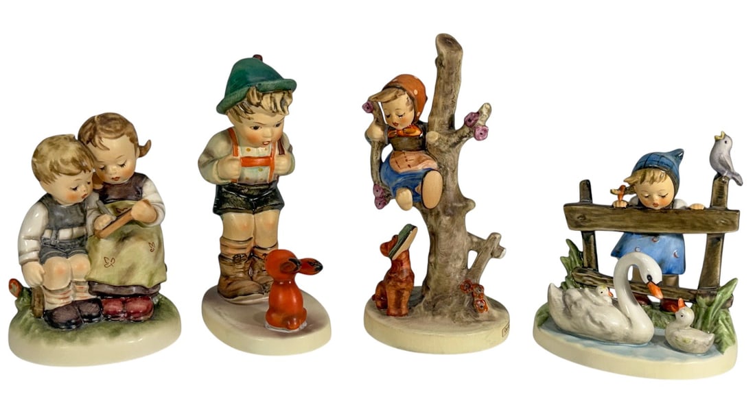 M.I. Hummel Goebel Porcelain Figurines 4pc LOT: Group of four M.I. Hummel porcelain figurines by Goebel, W. Germany. Includes a boy with red rabbit, two children reading together, a girl seated in a flowering tree with dog below, and a girl standin