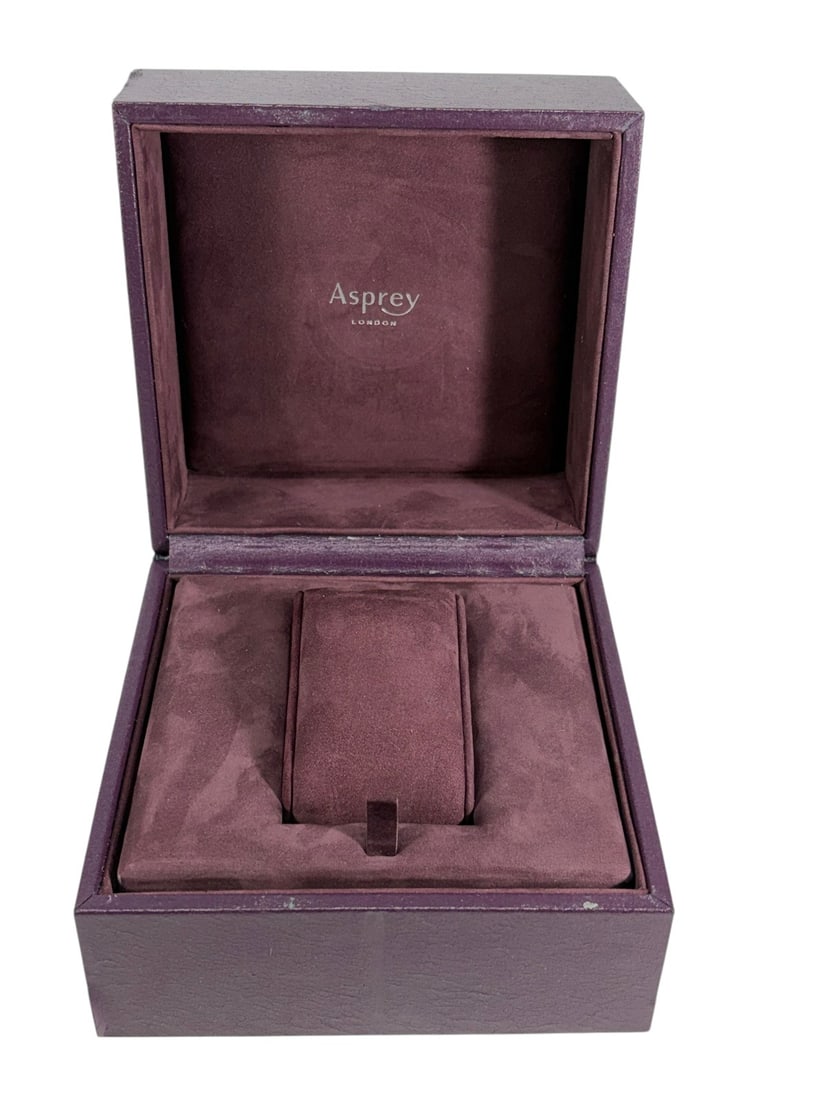Asprey London Watch Presentation Box & Booklet: Asprey London watch presentation box in burgundy leatherette finish with matching interior watch cushion and original Asprey watch collection booklet. The fitted interior is designed to accommodate a