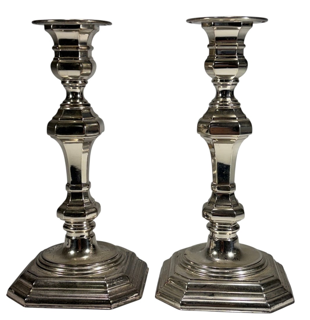VTG Pair of Sterling Silver Weighted Candlesticks: Pair of sterling silver weighted candlesticks with stepped octagonal bases and faceted baluster-form stems. Traditional design suitable for taper candles. Weighted and filled construction, not solid s