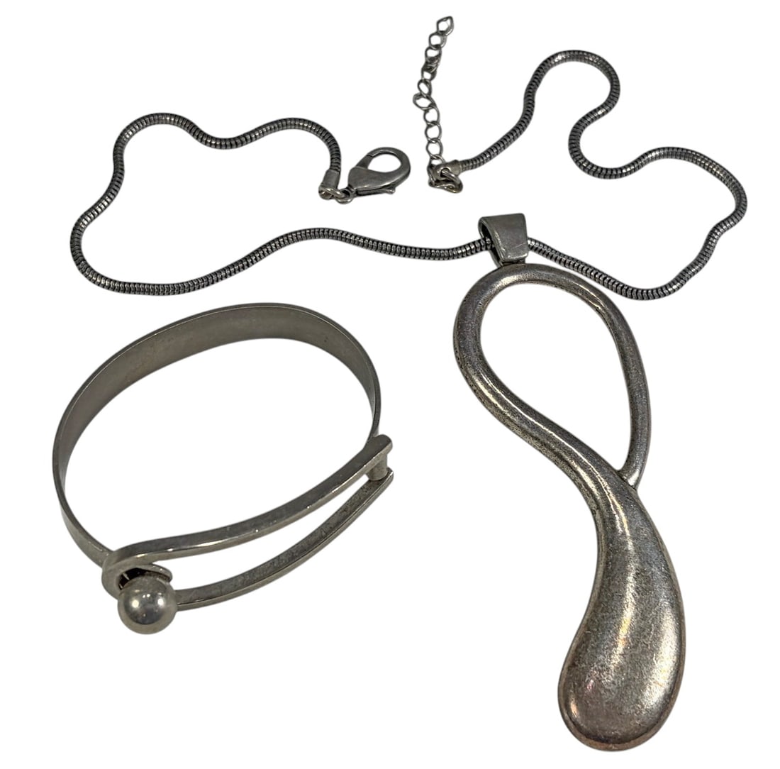 Goossens Cuff & Mon Bijou Pendant Jewelry 2pc LOT: Jewelry lot including a Goossens Paris style silver-tone cuff bracelet and a Mon Bijou silver-tone pendant necklace. The bracelet features the recognizable open-loop design with spherical accent. The