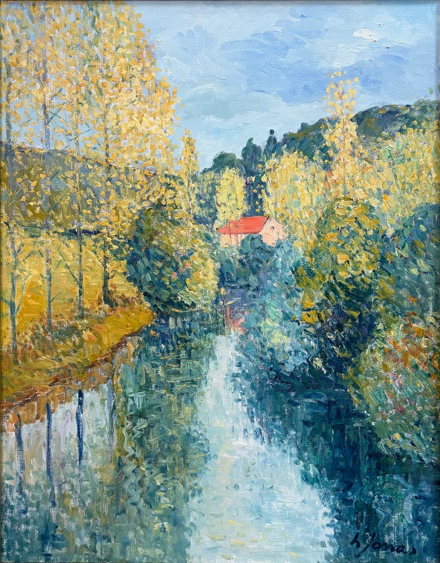 Harry Jonas 1893-1990 River Landscape Oil Painting: Oil painting on canvas by Harry Jonas depicting a tranquil river landscape with reflective water, flowering trees, and a small cottage nestled among lush foliage. Executed in an impressionist style