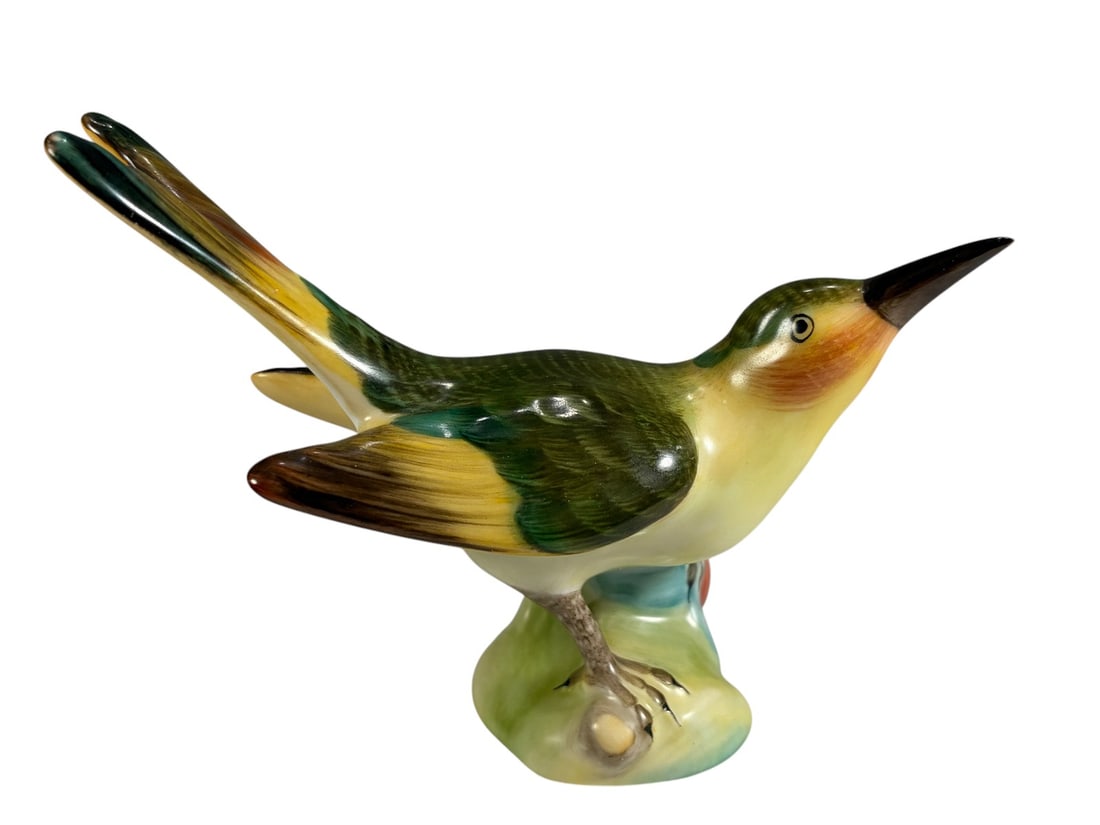 Herend Hand Painted Bird on Berry Branch Figurine: Herend Hungary hand-painted porcelain figurine depicting a colorful songbird perched on a stylized branch with red berries. The bird is decorated in shades of green, yellow, brown, and peach with deta
