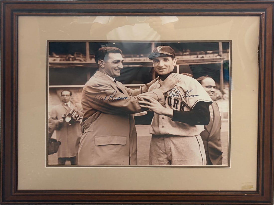 SIGNED Bobby Thomson Ralph Branca Baseball Photo: Framed sepia-tone baseball photograph featuring legendary rivals Bobby Thomson and Ralph Branca together in a postgame scene tied to the historic "Shot Heard Round the World." The image bears signatur