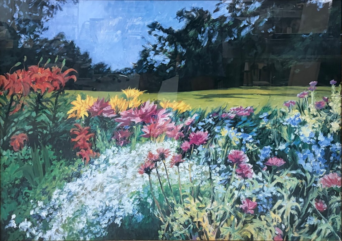 Framed Floral Garden Landscape Decorative Print: Decorative color print depicting a vibrant flower garden in bloom with red lilies, pink blossoms, white flowers, and a manicured lawn beneath a blue sky. Presented under glass with cream matting and a
