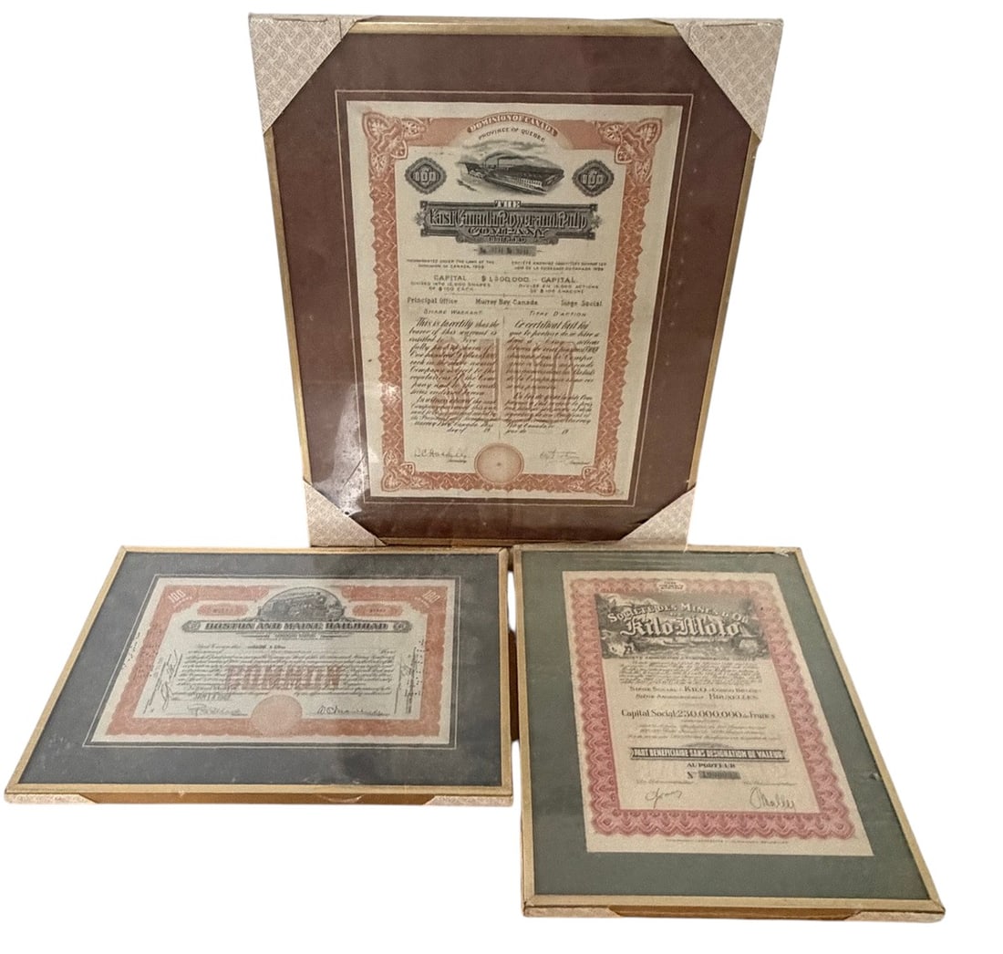 Collection of 3 Framed Historic Stock Certificates: Collection of three framed historic stock and share certificates, including Boston and Maine Railroad, East Canada Power and Pulp Company Limited, and Societe des Mines d'Or de Kilo-Moto (Belgian Cong
