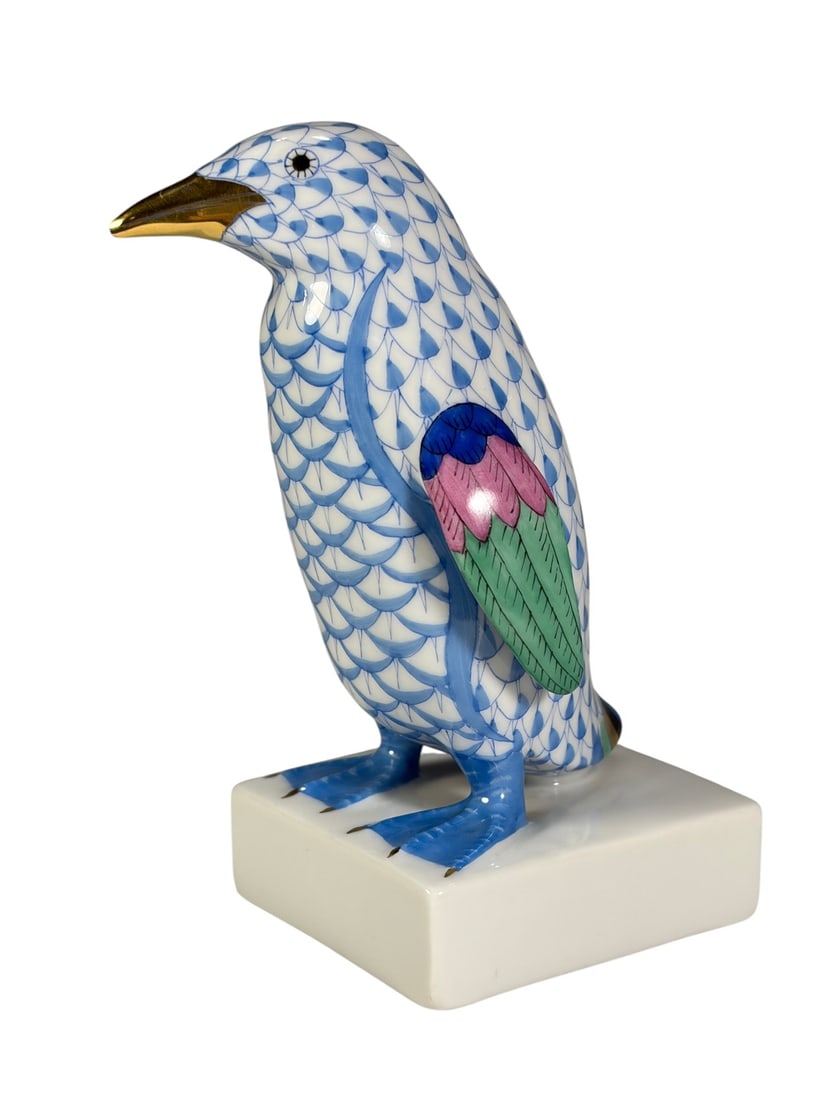 Herend Hungary Blue Fishnet Penguin Porcelain Fig: Herend Hungary handpainted porcelain penguin figurine decorated in the classic blue fishnet pattern with a gilt beak and colorful hand-painted wings in blue, pink, and green. The stylized bird stands 