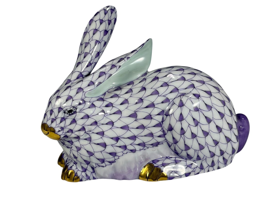 Herend Hungary Fishnet Porcelain Purple Rabbit Fig: Herend Hungary hand-painted porcelain rabbit figurine decorated in a lavender fishnet pattern with gilt accents. Modeled in a resting pose with upright ears and rounded tail. Marked underside with for