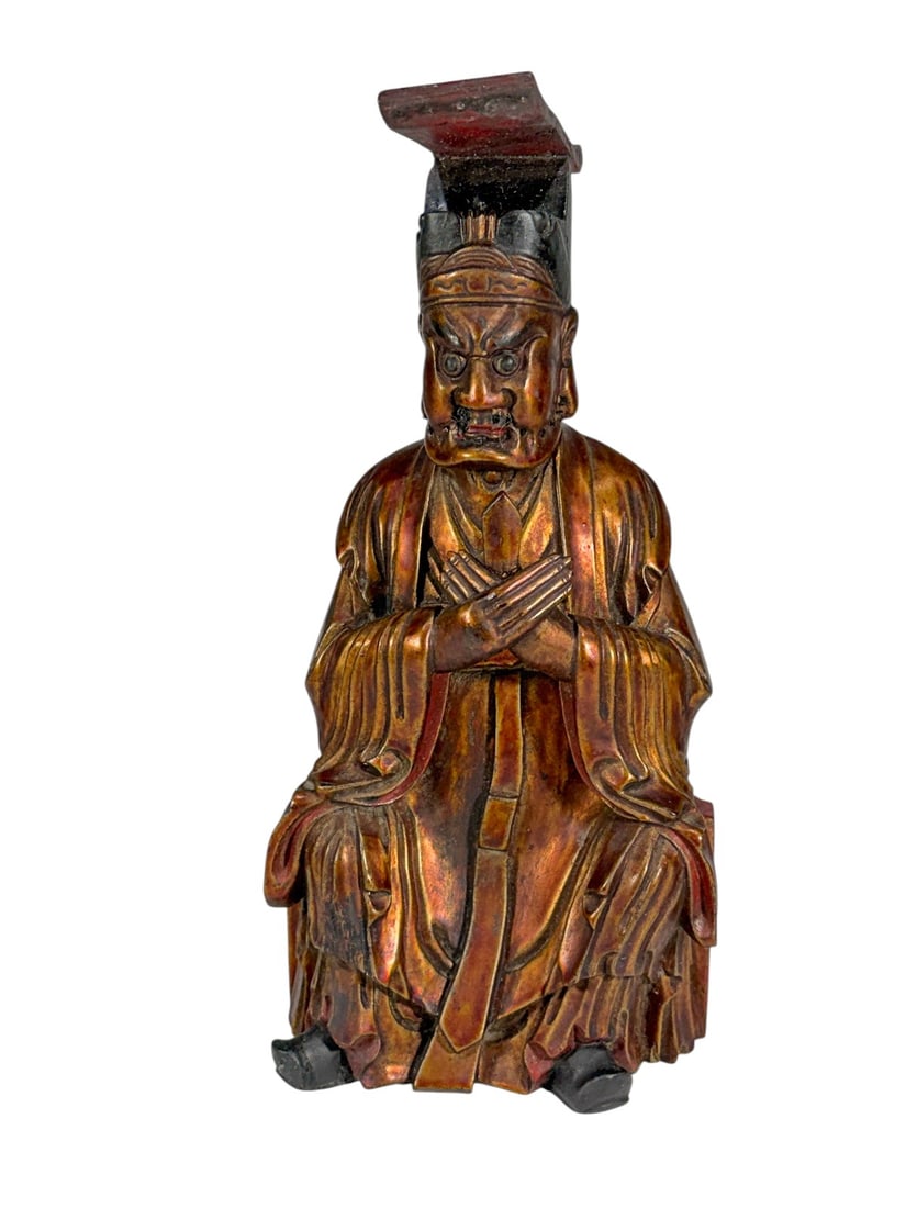Chinese Qing Style Patinated Wood Guardian Figure: Chinese carved wood guardian figure, likely Qing Dynasty style, depicted seated in traditional robes and an official headdress. Finished with an attractive copper-tone patina that highlights the carve