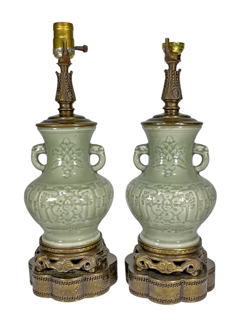 Pair Chinese Celadon Style Porcelain Table Lamps: Pair of Chinese celadon style porcelain table lamps of baluster form, each decorated with molded floral and foliate motifs in relief and fitted with applied loop handles at the neck. Finished in a pal