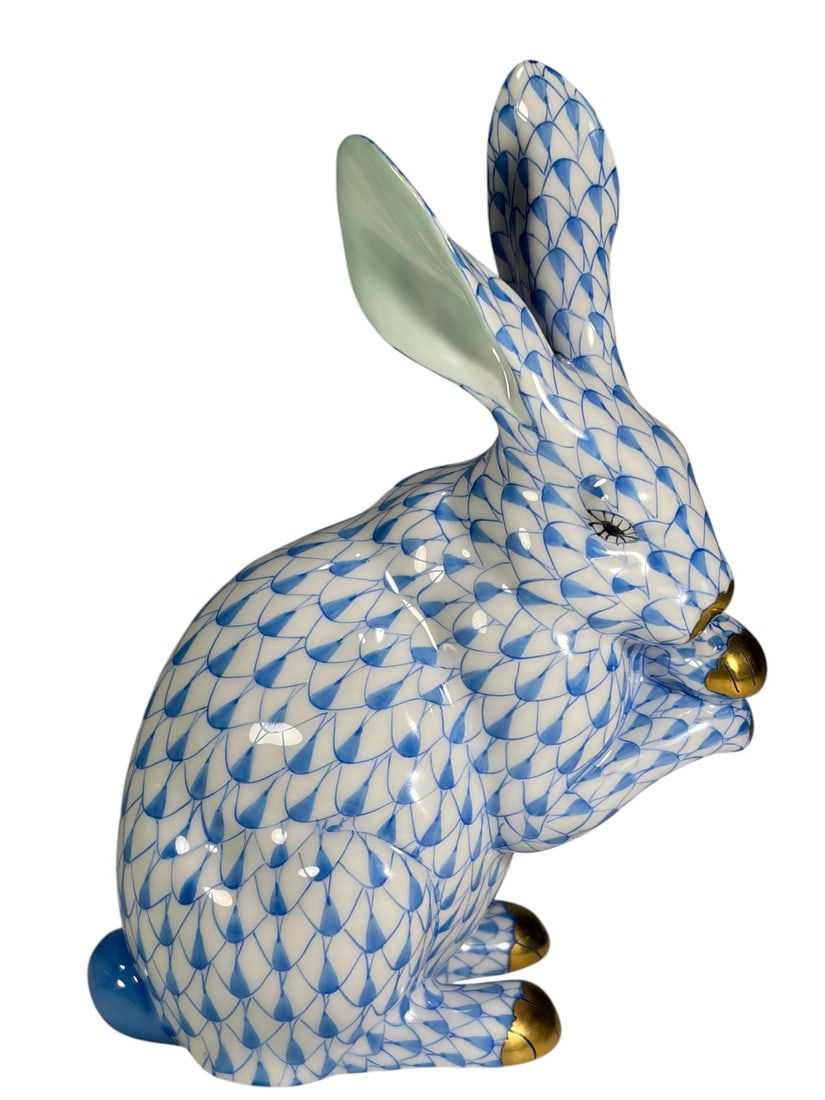 Herend Hungary Blue Fishnet Begging Rabbit Fig: Herend Hungary handpainted porcelain rabbit figurine decorated in the blue fishnet pattern with gilt accented nose and paws. The rabbit is modeled in an upright begging pose with raised forepaws and t