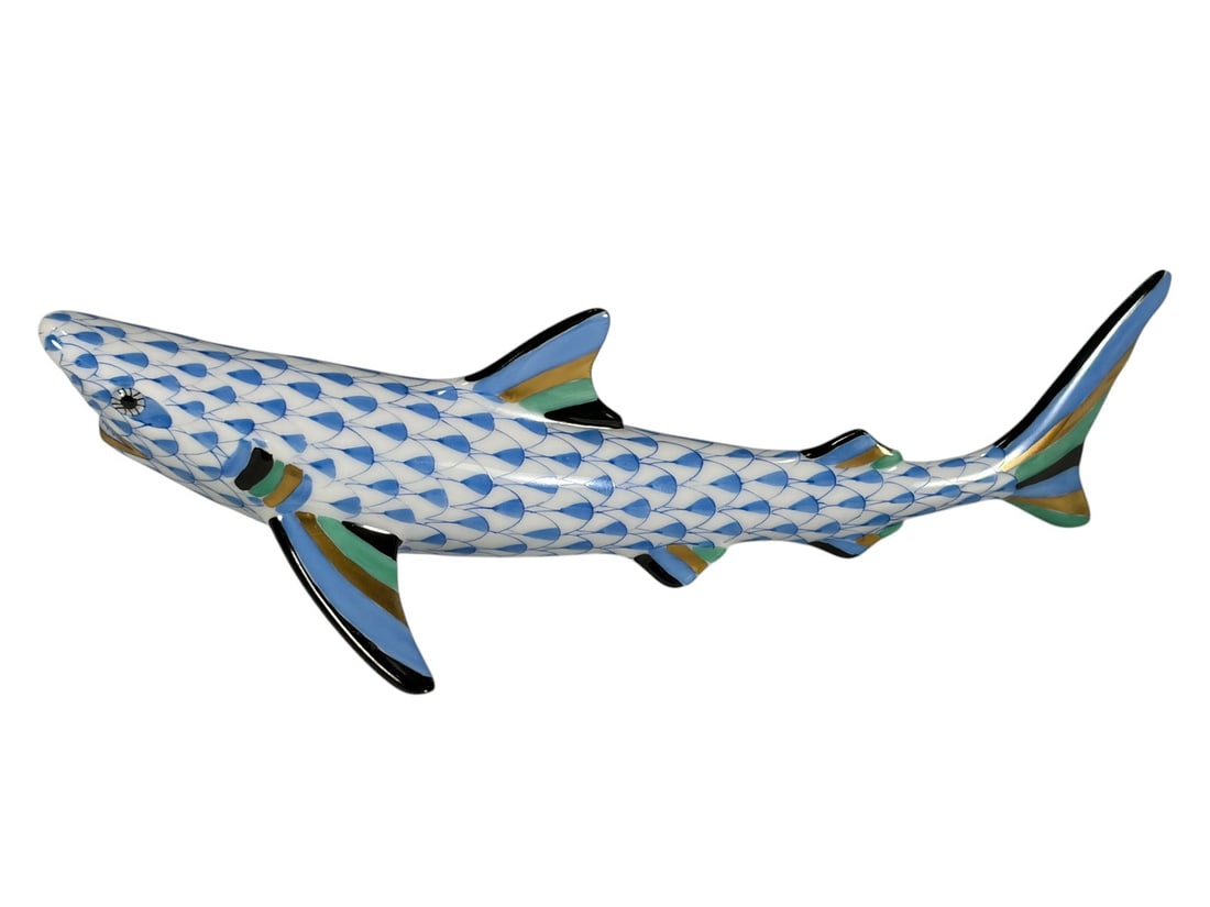 Herend Hungary Blue Fishnet Shark Porcelain Fig: Herend Hungary handpainted porcelain shark figurine decorated in the Blue Fishnet pattern. The streamlined figure is modeled swimming with extended fins highlighted in blue, green, black, and gilt acc