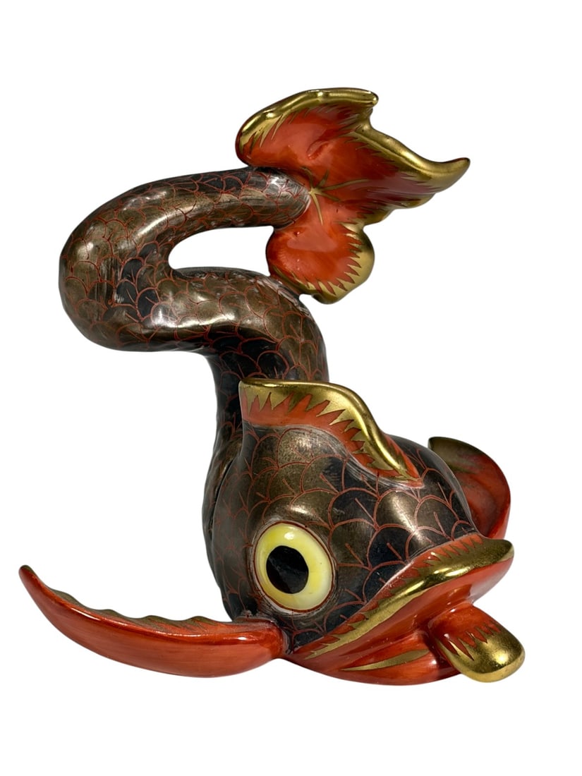 Herend Hungary Handpainted Fish Porcelain Figure: Hand-painted Herend porcelain figural fish with stylized dragon or koi-like form. Decorated in dark brown, red, and gold tones with scale patterning and exaggerated eyes, fins, and tail. The sculptura