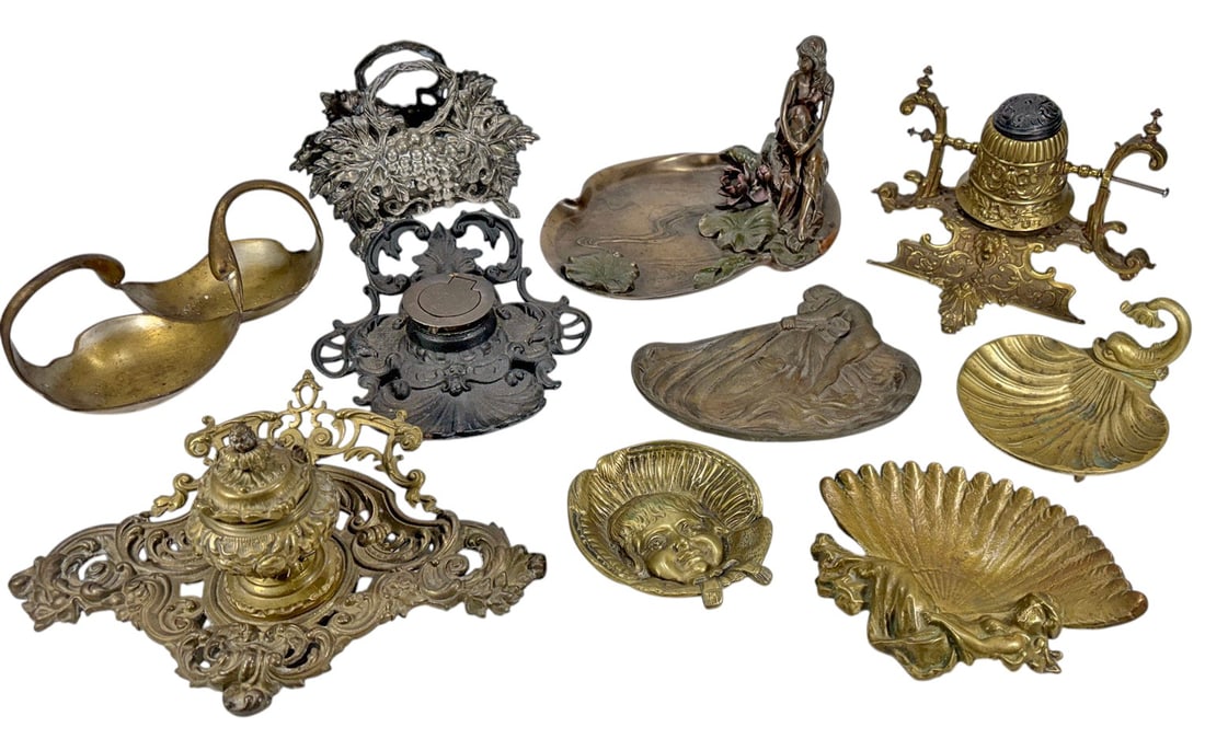 Art Nouveau Brass Bronze Metal Desk Articles 10pcs: Lot of 10 decorative articles in brass, bronze, cast metal, and mixed materials. Includes an ornate double inkwell stand, Art Nouveau style figural trays and dishes, a grape-form basket, shell-form di