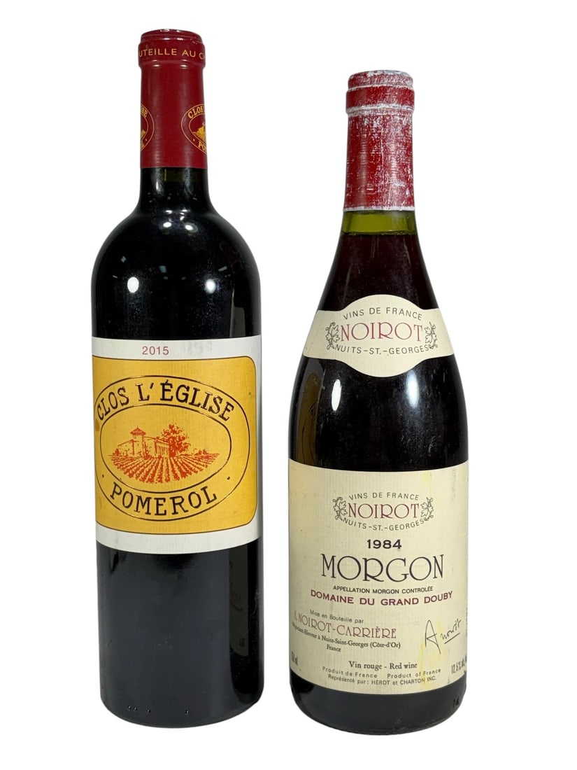 French Red Wine Bottles Pomerol & Morgon 1984 2pcs: Lot of two French red wine bottles including a 2015 Clos L'Eglise Pomerol, Grand Vin de Bordeaux, 750 ml, and a 1984 Morgon Domaine du Grand Douby by Noirot, Nuits-Saint-Georges. Both bottles retain o